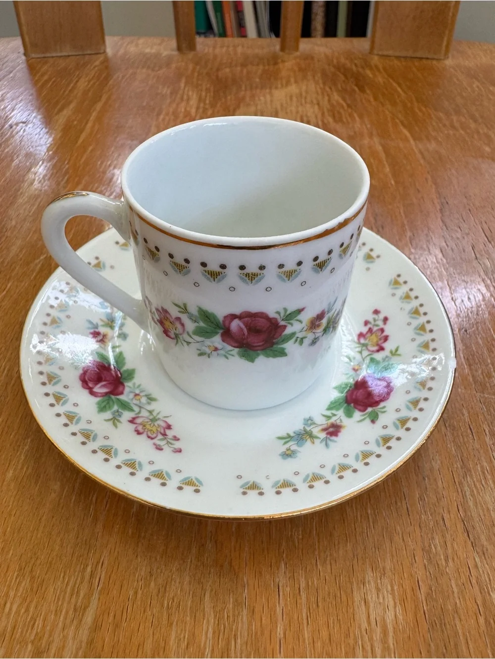 Vintage Espresso Cup and Matching Saucer. White Porcelain with Floral Motif.